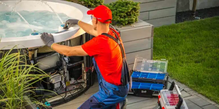 man repairing hot tub