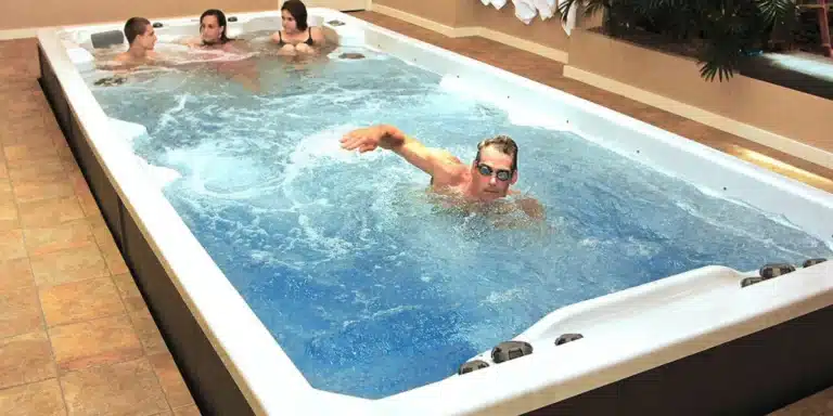 man swimming in swim spa